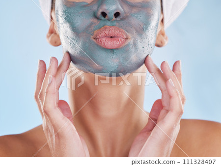 Skincare wellness, charcoal face mask and beauty product for healthy skin against blue mockup studio background. Model pouting mouth, care for body and natural cosmetic treatment for wellbeing 111328407