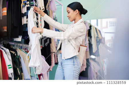 Happy, shopping and woman search with smile in shop, retail and mall for fashion clothes in store. Designer, customer and small business girl spending money on brand clothing or black Friday sale Happy, shopping and woman search with smile in shop, retail and mall for fashion clothes in store. Designer, customer and small business girl spending money on brand clothing or black Friday sale 111328559