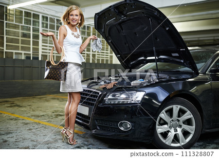 Woman, portrait and car or engine fail in parking garage or blow gasket for mechanical failure, accident or stuck. Female person, confused and smile or transport damage for auto, bonnet or cylinder 111328807