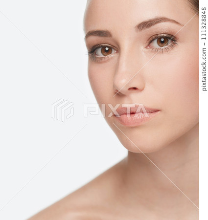 Portrait, beauty and natural woman in studio isolated on white background for wellness or cosmetics. Face, skincare or dermatology with confident young model closeup for facial or collagen treatment 111328848