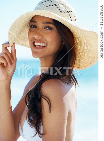 Woman, hat and happy at beach in portrait, nature and traveling to ocean for peace on vacation. Female person, outdoors and calming water on summer holiday, smiling and relaxing on tropical island Woman, hat and happy at beach in portrait, nature and traveling to ocean for peace on vacation. Female person, outdoors and calming water on summer holiday, smiling and relaxing on tropical island 111328916