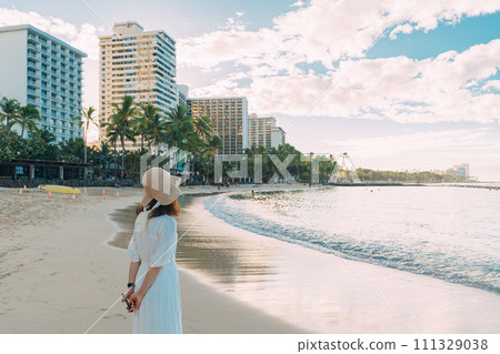 girl walking on waikiki beach girl walking on waikiki beach 111329038