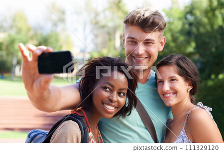 University, friends and students for selfie at college for learning, studying together and knowledge. Education, school and happy man and women take picture for social media, online post and bonding 111329120