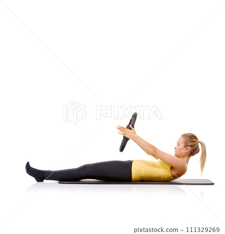 Woman, pilates ring and arms for exercise training on yoga mat for resistance healthy, strength or studio white background. Female person, equipment for muscle flexibility, core balance or mockup Woman, pilates ring and arms for exercise training on yoga mat for resistance healthy, strength or studio white background. Female person, equipment for muscle flexibility, core balance or mockup 111329269