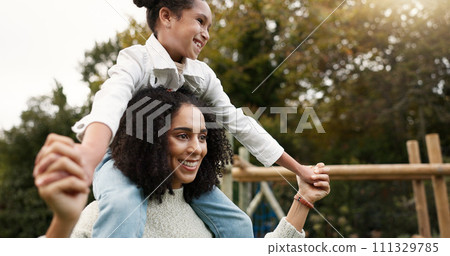 Mother, daughter and piggyback walking in park or garden for fun bonding, holiday or weekend outside. Happy mom carrying her child on shoulders for family time together in nature or forest by house 111329785
