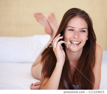 Woman, phone call and relax on bed in communication, happy conversation and thinking of holiday ideas. Young person talking on her mobile or listening to information, news or chat in bedroom at home 111329915