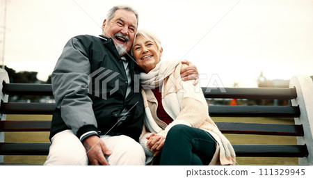 Hug, bench and senior couple on bench at park with love to relax with quality time or care. Retirement, support and elderly man or woman in nature with embrace or laugh in outdoor with bonding. Hug, bench and senior couple on bench at park with love to relax with quality time or care. Retirement, support and elderly man or woman in nature with embrace or laugh in outdoor with bonding. 111329945