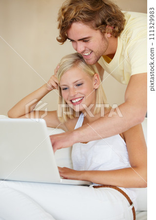 Love, laptop and couple on a sofa with social media search, movies or streaming at home together. Online shopping, relax and people in living room checking ecommerce, website or deal, sale or survey Love, laptop and couple on a sofa with social media search, movies or streaming at home together. Online shopping, relax and people in living room checking ecommerce, website or deal, sale or survey 111329983