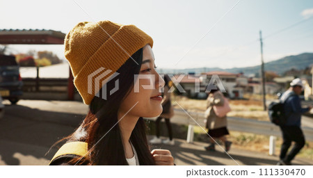 Asian, woman at train station and travel, commute or holiday and freedom outdoor with profile. Railway, walking on platform and transportation, journey for adventure in China and weekend trip Asian, woman at train station and travel, commute or holiday and freedom outdoor with profile. Railway, walking on platform and transportation, journey for adventure in China and weekend trip 111330470