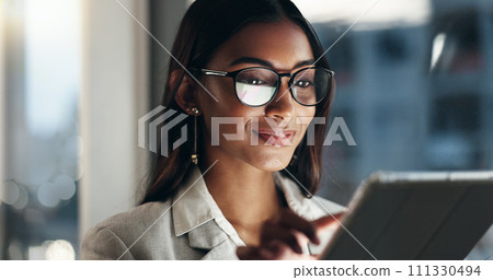 Tablet, overtime and happy woman in office with glasses, reflection with planning and website. Vision, smile and businesswoman typing email, late at night work and research on future ideas for agency 111330494