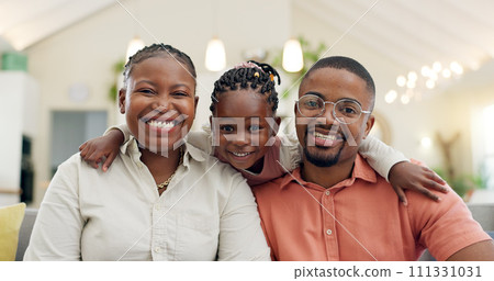 Black family, face and happy with parents and kid at home, love and bonding with hug and spending time together. Man, woman and girl child, happiness and portrait and people smile in living room 111331031