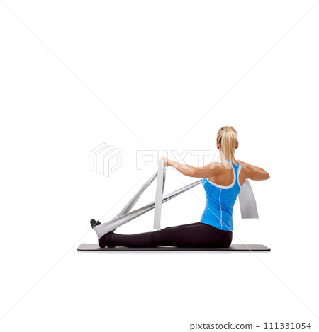 Wellness, resistance band and woman doing exercise in studio for health, fitness and bodycare. Sport, yoga mat and young female person from Australia with arms workout or training by white background 111331054