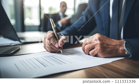 Close-up of a businessman's hands holding a pen and signing a document with another Close-up of a businessman's hands holding a pen and signing a document with another 111331336