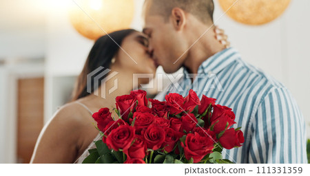 Couple, flowers and kiss for anniversary celebration, marriage and loyalty or commitment to love. People, happy and romance for relationship milestone, bonding and plant gift for support at home 111331359