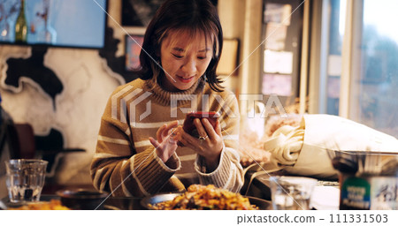 Japanese woman, smartphone and healthy food in restaurant for dinner, nutrition and happy on social media. Person, mobile phone or lunch in tokyo city with umami flavor or vegetarian dish on vacation 111331503