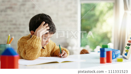 Child, drawing or boy writing homework on notebook in kindergarten education for growth development. Project, creative or young art student with color pencil learning or working on sketching skills Child, drawing or boy writing homework on notebook in kindergarten education for growth development. Project, creative or young art student with color pencil learning or working on sketching skills 111331523