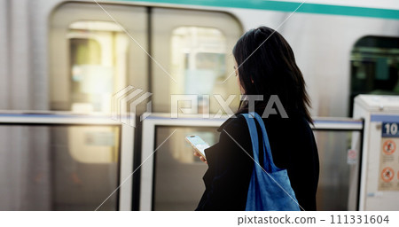 Woman, train travel and phone with back, bag and journey on metro railway with typing for web chat. Girl, person and smartphone with click, contact or social network app on public transport system 111331604