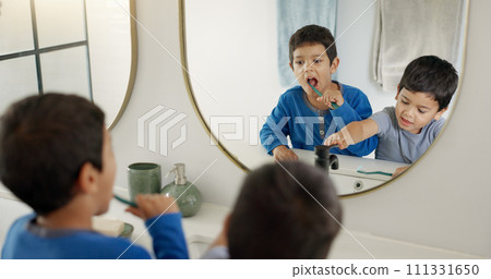 Boy kids, toothbrush and together in bathroom for hygiene, wellness and self care with dental product in family home. Young male children, teeth whitening and mirror for health, learning and cleaning Boy kids, toothbrush and together in bathroom for hygiene, wellness and self care with dental product in family home. Young male children, teeth whitening and mirror for health, learning and cleaning 111331650