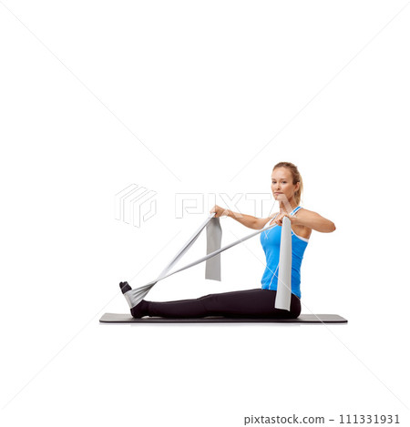 Fitness, resistance band and portrait of woman doing exercise in studio for health, wellness and bodycare. Sport, yoga mat and person from Canada with arm workout or training by white background. 111331931
