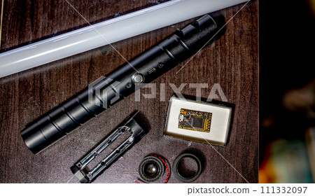 Assorted parts to build a laser sword from a kit with a hilt, neon blade, sound board and control chip. Assorted parts to build a laser sword from a kit with a hilt, neon blade, sound board and control chip. 111332097