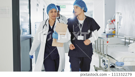 Doctors, nurses and women walking, talking and planning healthcare, clinic management and workflow schedule. Medical worker, surgeon and mentor support, hospital teamwork and folder or patient charts 111332279