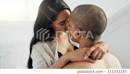 Couple, hug and kiss in bedroom with smile for love and commitment, romance for happiness and chemistry. People in healthy relationship, bonding and care at home with trust and partner for life Couple, hug and kiss in bedroom with smile for love and commitment, romance for happiness and chemistry. People in healthy relationship, bonding and care at home with trust and partner for life 111332285
