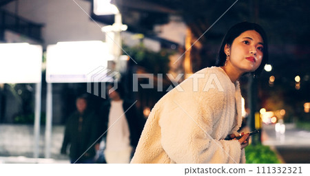 Japanese woman, taxi and smartphone at night for location, city street and looking for transport. Person, waiting and cab search with cellphone app for travel, road and tokyo town with technology Japanese woman, taxi and smartphone at night for location, city street and looking for transport. Person, waiting and cab search with cellphone app for travel, road and tokyo town with technology 111332321