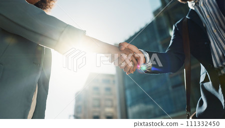 Outdoor, business people and professional with handshake, conversation and contract with lens flare, corporate and talk. Staff, employees in a city and coworkers with hello, partnership or urban town 111332450