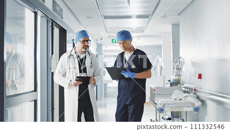 Healthcare, talking and doctors with a tablet at a hospital for health advice or surgery communication. Help, clinic and medical employees speaking with technology, planning and schedule for nursing 111332546