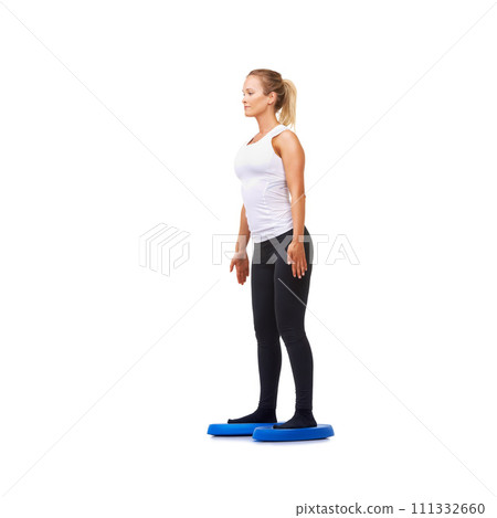 Balance, health and young with woman on disk in studio for workout, mindfulness or exercise. Wellness, challenge and training with person on white background for flexibility, smile or aerobics 111332660