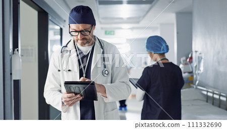 Surgeon, doctor and tablet for hospital, healthcare or clinic research, online planning and schedule management. Medical professional typing on digital technology for surgery results, charts or data Surgeon, doctor and tablet for hospital, healthcare or clinic research, online planning and schedule management. Medical professional typing on digital technology for surgery results, charts or data 111332690