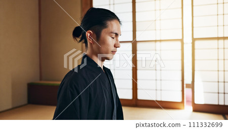 Martial arts man, meditation and training in Japanese dojo with mindfulness, zen or chakra balance in morning. Fighter, mma or karate person with peace, breathing and calm for yoga, wellness or floor 111332699