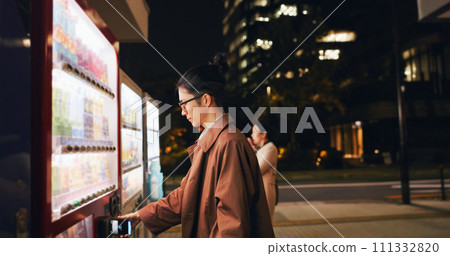 Vending machine, man and phone payment at night, automatic digital purchase or choice in city outdoor. Smartphone, shopping dispenser and Japanese business person on mobile technology in urban Tokyo Vending machine, man and phone payment at night, automatic digital purchase or choice in city outdoor. Smartphone, shopping dispenser and Japanese business person on mobile technology in urban Tokyo 111332820