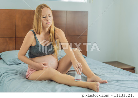 Expectant woman faces challenges while doing leg epilation during pregnancy Expectant woman faces challenges while doing leg epilation during pregnancy 111333213