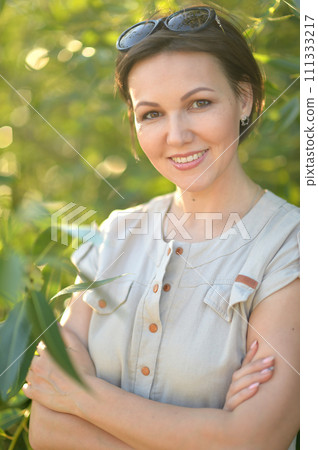 Close up portrait of beautiful young woman in summer park Close up portrait of beautiful young woman in summer park 111333217