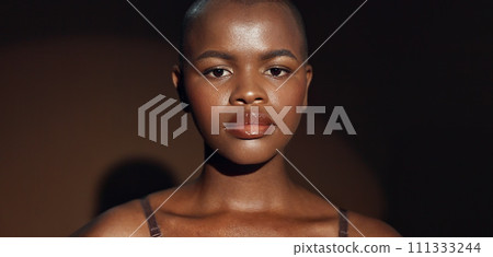 Face, vision and beauty with a natural black woman on a dark background in studio for feminine wellness. Hands, skincare and thinking with a young model touching her body or skin in satisfaction 111333244