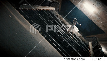 Dance, night and woman with energy, outdoor and artistic with performance, training or creativity. Person, dancer and girl with workout, culture or practice with routine, freedom or ballet with light 111333245