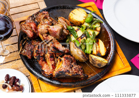 Grilled beef with spicy pepper and potatoes served beautifully on plate Grilled beef with spicy pepper and potatoes served beautifully on plate 111333877