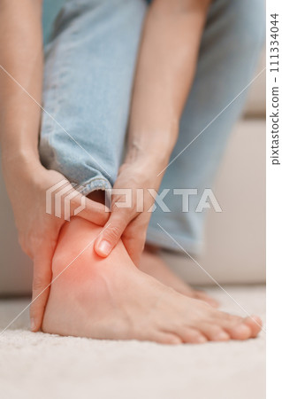 woman having leg pain due to Ankle Sprains or Achilles Tendonitis and Shin Splints ache. injuries, health and medical concept woman having leg pain due to Ankle Sprains or Achilles Tendonitis and Shin Splints ache. injuries, health and medical concept 111334044