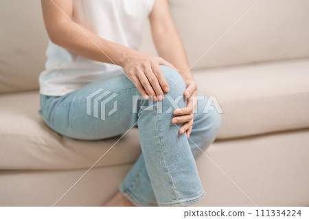 woman having knee ache and muscle pain due to Runners Knee or Patellofemoral Pain Syndrome, osteoarthritis, arthritis, rheumatism and Patellar Tendinitis. medical concept 111334224