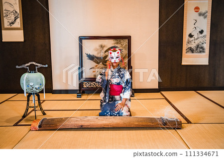 Asian girl in kimono and umbrella in Japanese theme park Hinoki Land in Chai Prakan District, Chiang 111334671