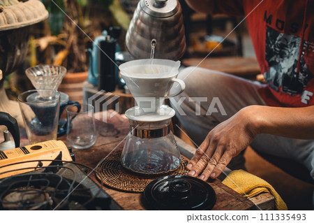 Drip coffee,coffee dripper and hands barista make coffee 111335493
