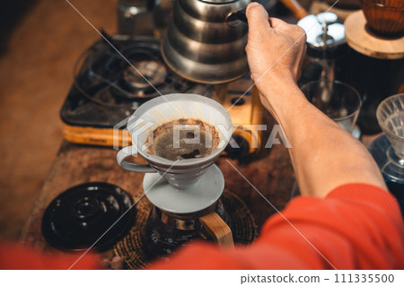 Drip coffee,coffee dripper and hands barista make coffee 111335500