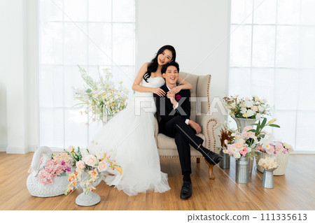 Groom and bride together, exuding elegance and joy in a bright wedding portrait setting - Pre wedding posed for photography Groom and bride together, exuding elegance and joy in a bright wedding portrait setting - Pre wedding posed for photography 111335613