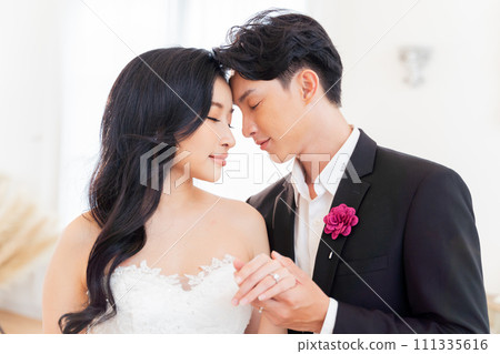 Bride and groom showcase their rings, a close-up view., symbolizing eternal love and commitment - wedding ceremony concept 111335616