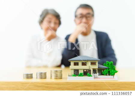 Thinking senior couple real estate Thinking senior couple real estate 111336057