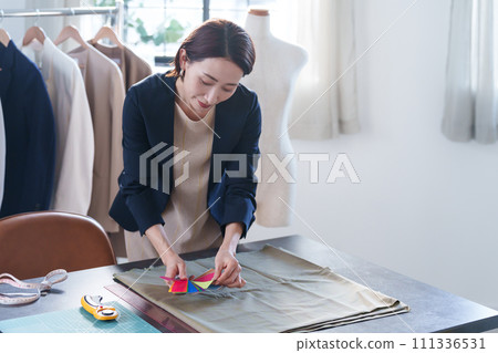 Working fashion designer Working fashion designer 111336531