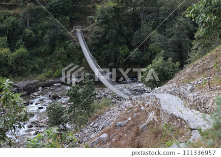 long suspension bridge in nepal, gandaki village 111336957
