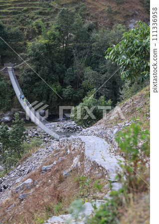 long suspension bridge in nepal, gandaki village 111336958