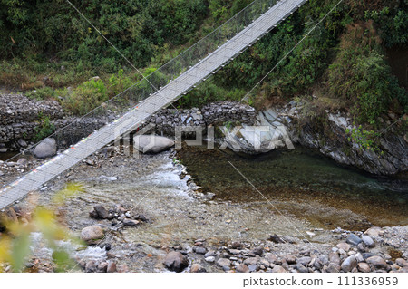 long suspension bridge in nepal, gandaki village 111336959
